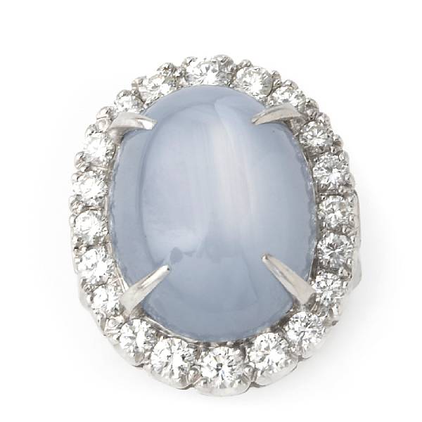 Appraisal: A blue-gray star sapphire diamond and platinum ring estimated total