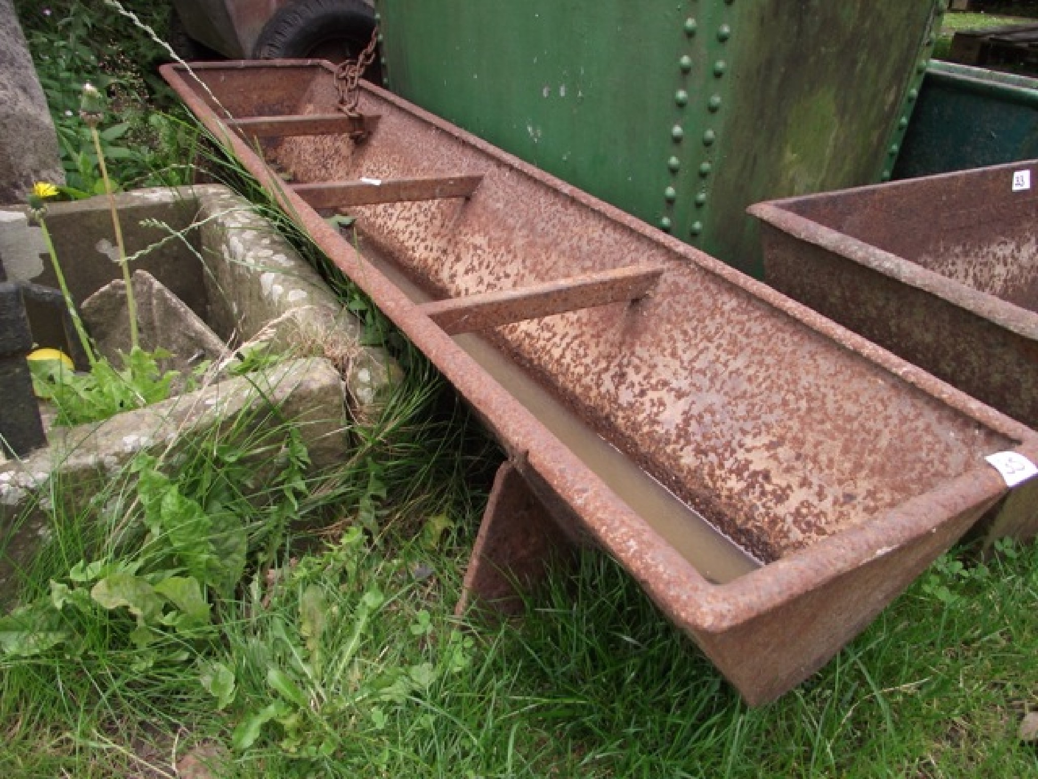 Appraisal: A vintage cast iron three divisional feeding trough of rectangular