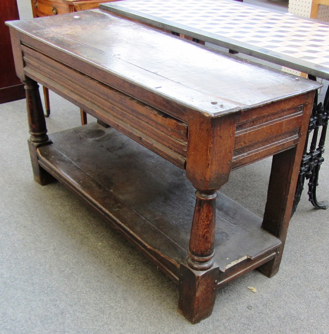 Appraisal: A mid th century oak low table formerly with superstructure