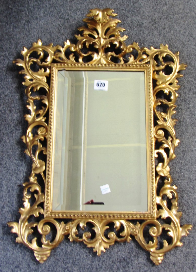 Appraisal: A small th century gilt framed wall mirror with pierced