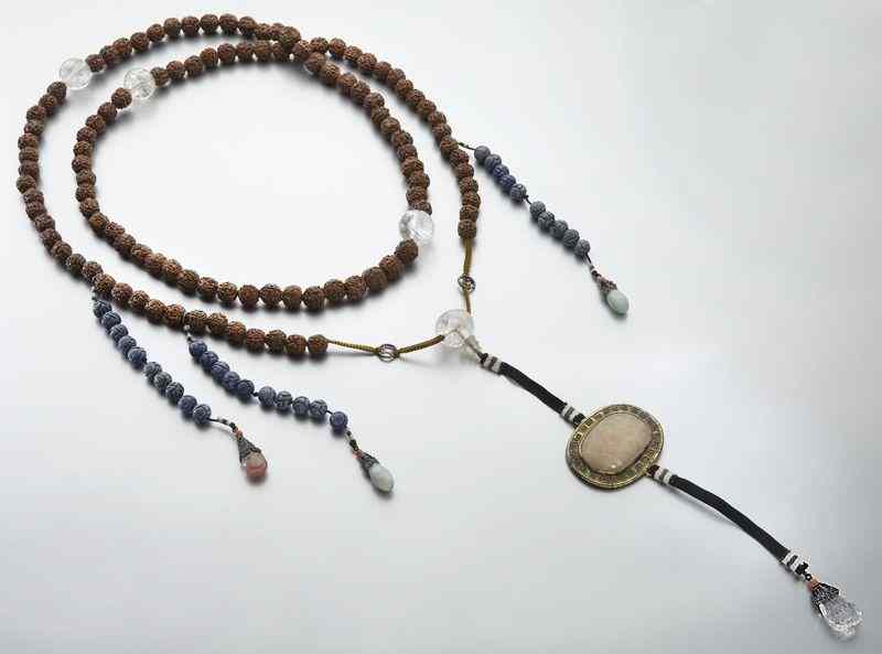 Appraisal: Chinese Qing court beads comprised of walnut rockcrystal Peking glass