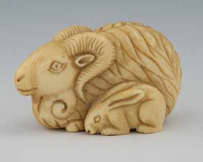 Appraisal: A Carved Ivory Netsuke of a Goat and a Rabbit