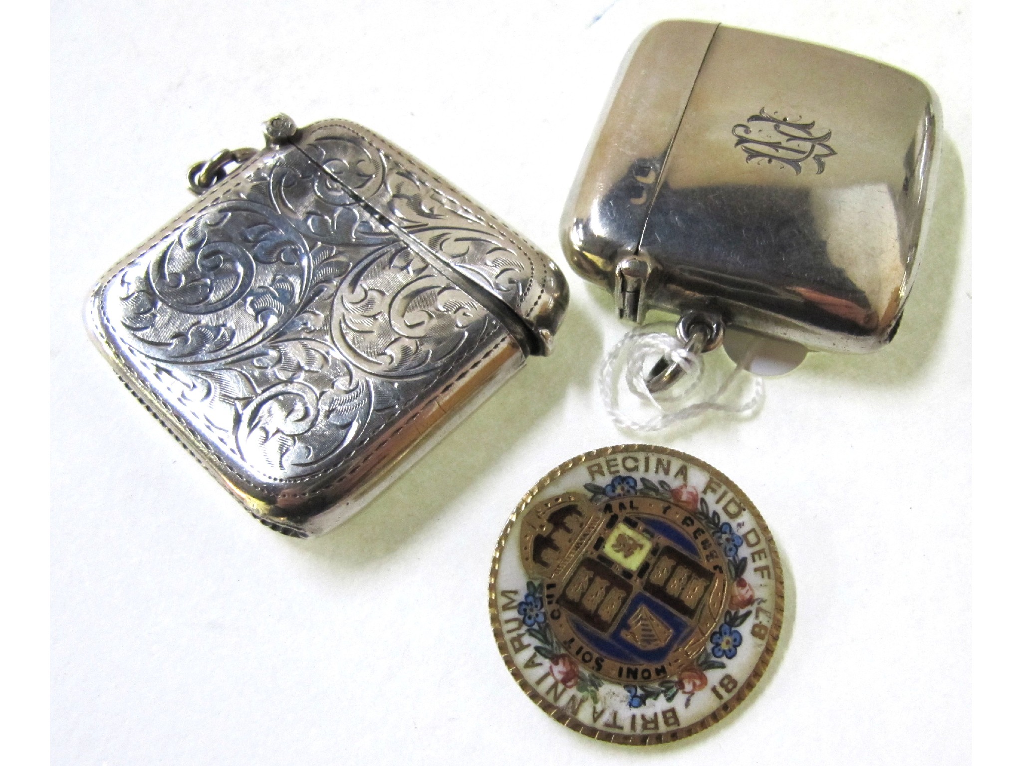 Appraisal: A lot comprising two silver vestas and an enamelled coin