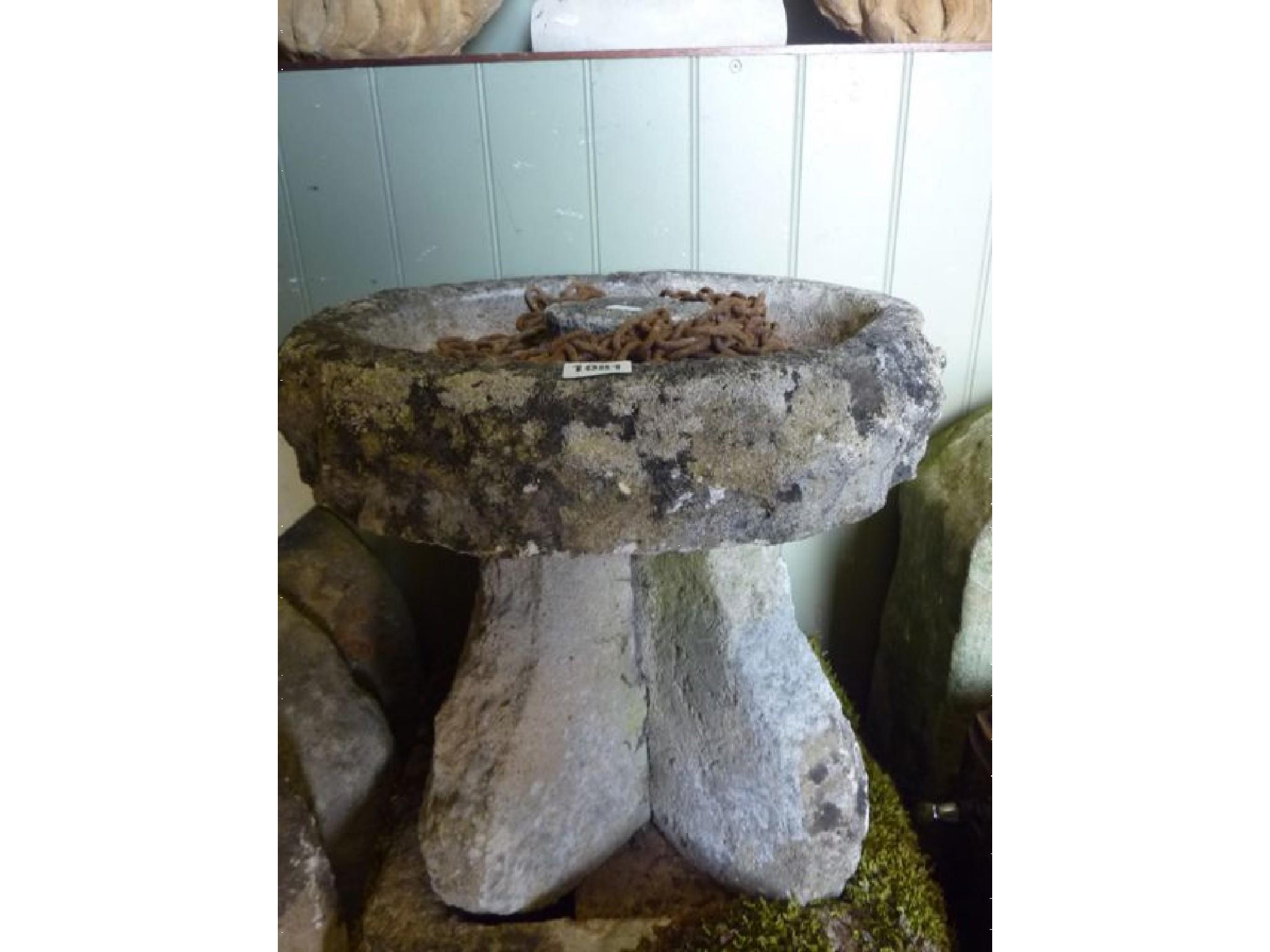 Appraisal: An unusual weathered composition stone bird bath the circular shallow