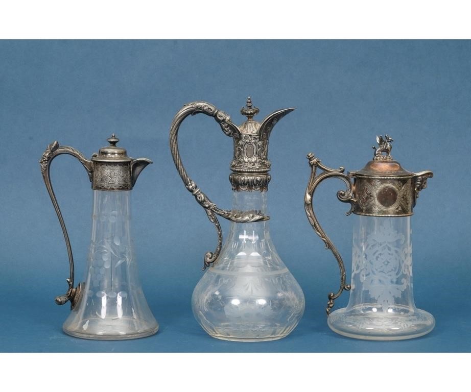 Appraisal: Ornate Victorian silverplate and glass claret jug together with two