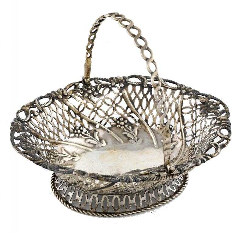 Appraisal: A GEORGE III PIERCED AND WRYTHEN FLUTED OVAL BASKET embossed