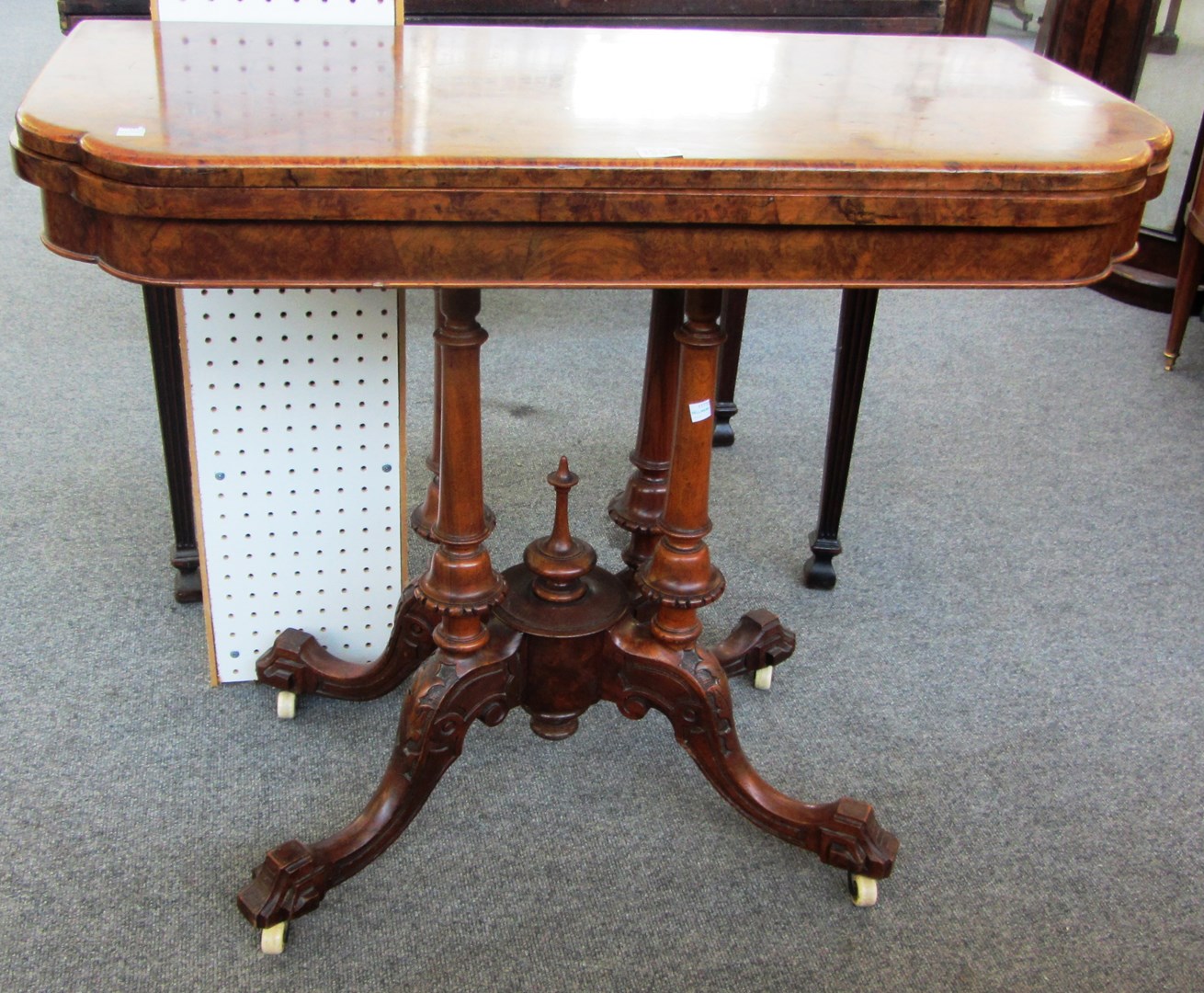 Appraisal: A Victorian figured walnut card table on four turned and