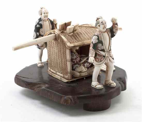 Appraisal: A Japanese Ivory Okimono the figural group depicting two attendants