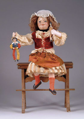 Appraisal: SCHOOL GIRL ATOP DESK AUTOMATON The mate to the boy