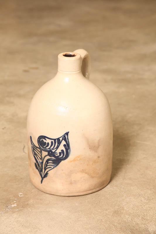 Appraisal: STONEWARE JUG One gallon jug with cobalt stylized flower Illegible