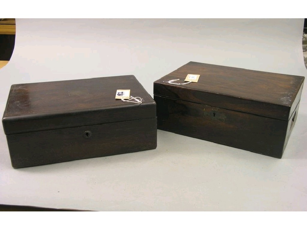 Appraisal: Two Victorian rosewood writing boxes each with enclosed slope and