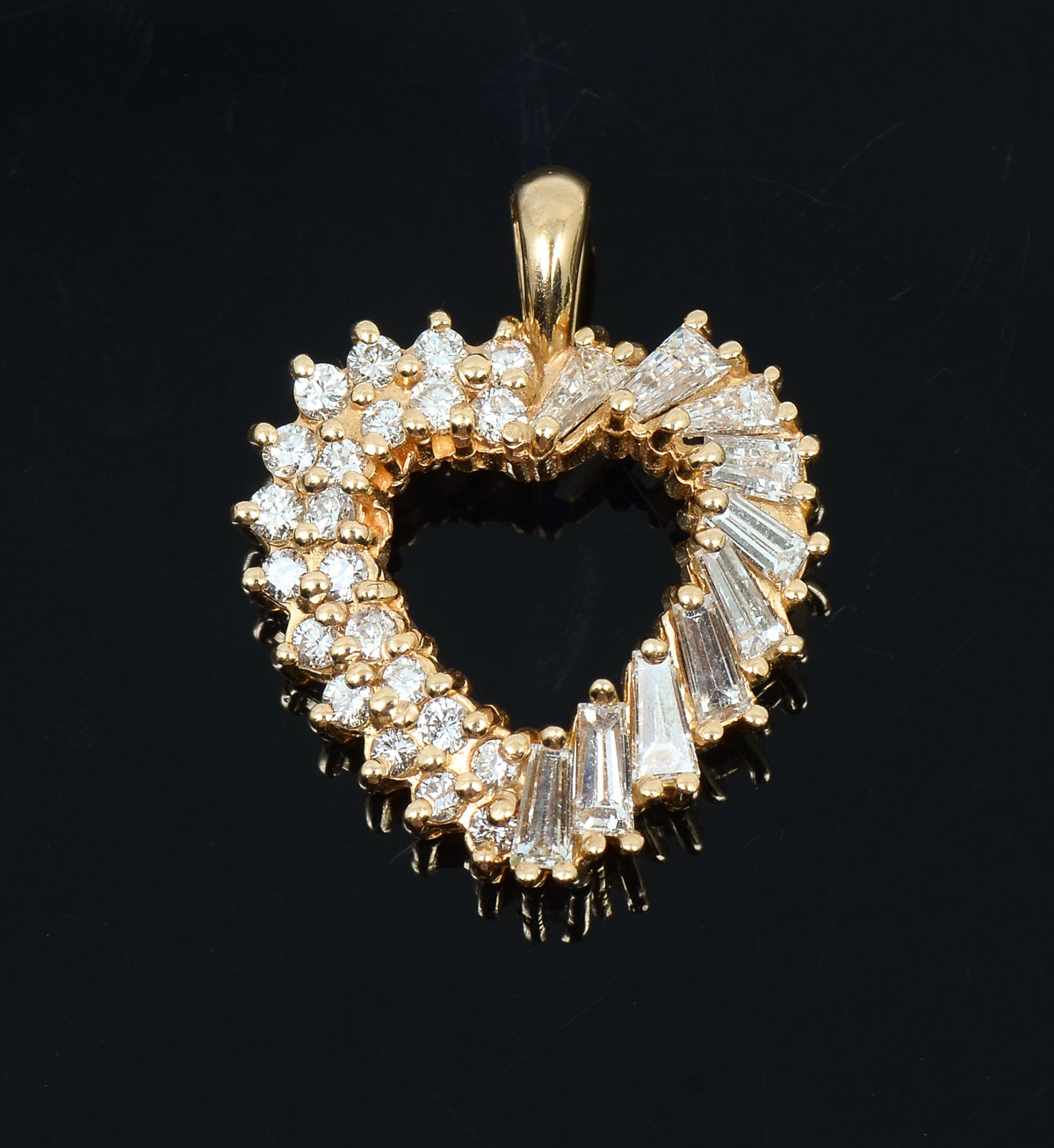 Appraisal: K HEART SHAPED DIAMOND PENDANT round brilliant cut and tapered