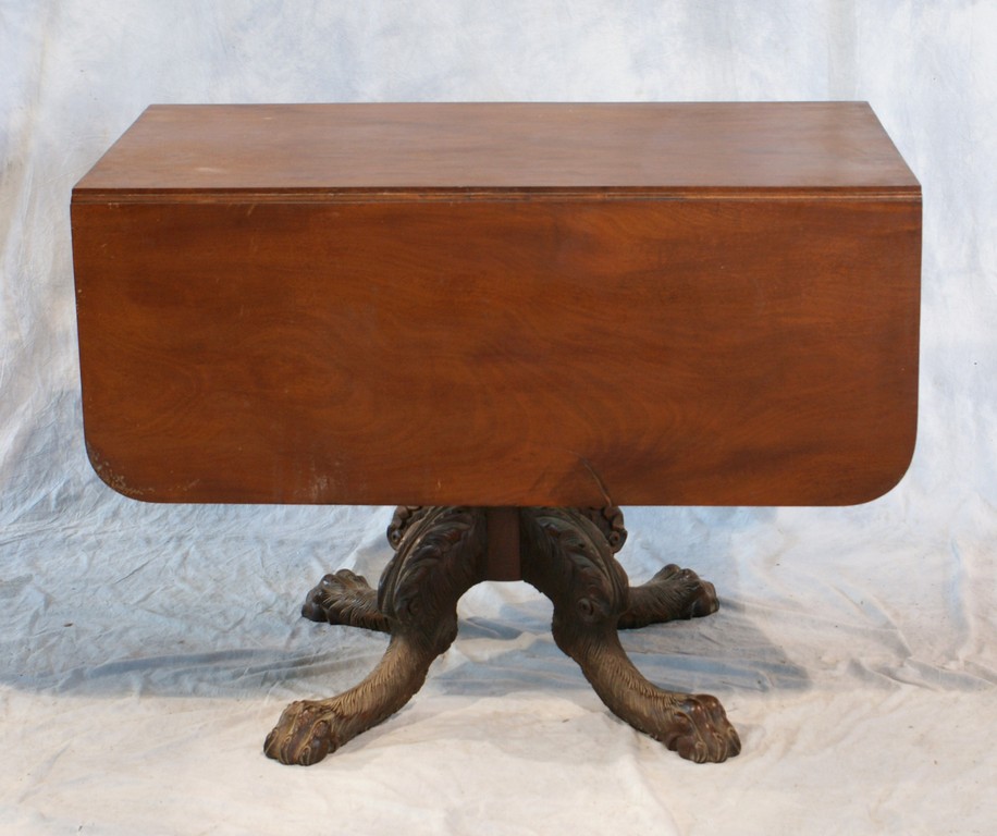 Appraisal: Carved mahogany American Federal drop leaf center table on acanthus