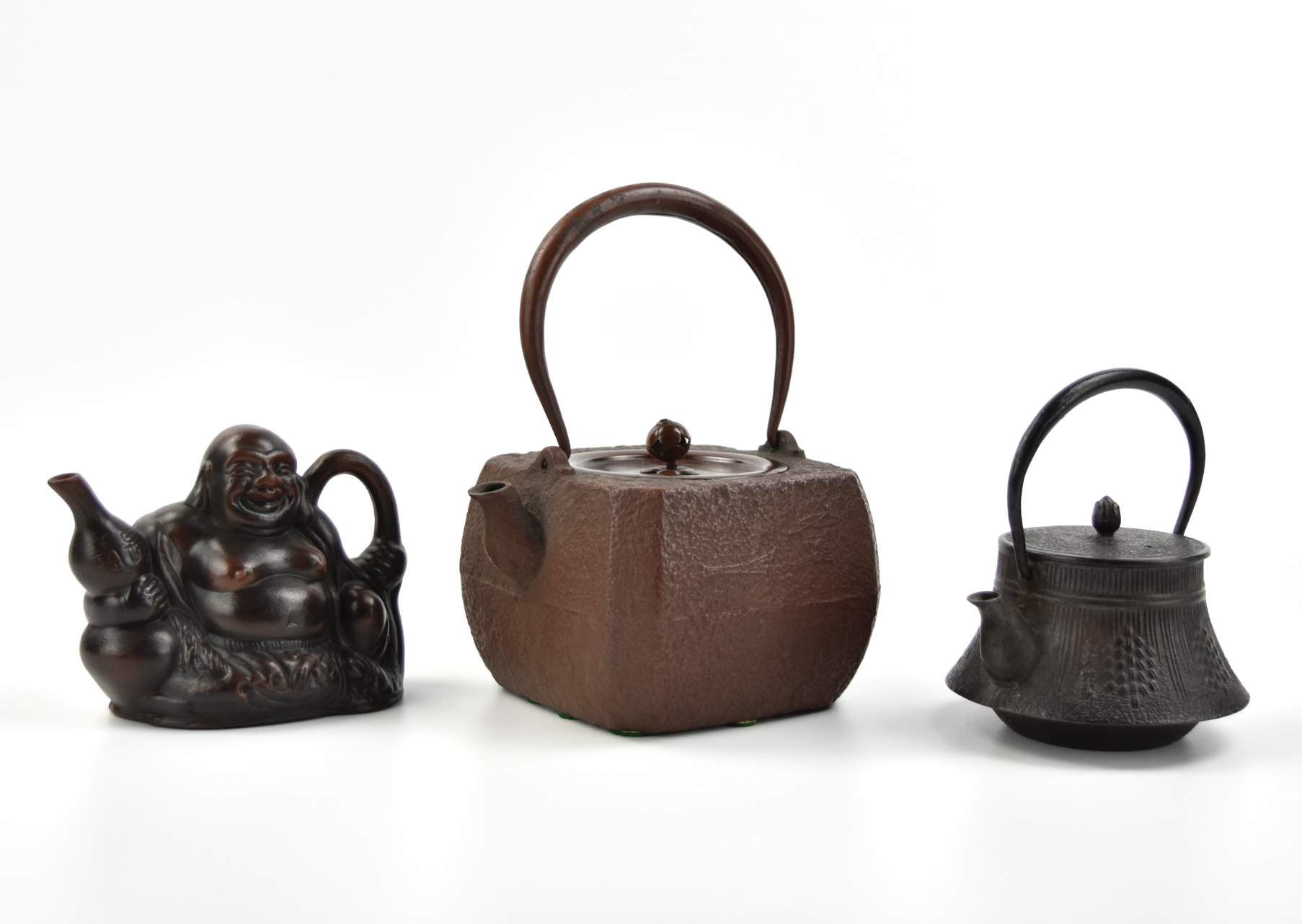 Appraisal: a square shaped of a bronze stone-like teapot with handle