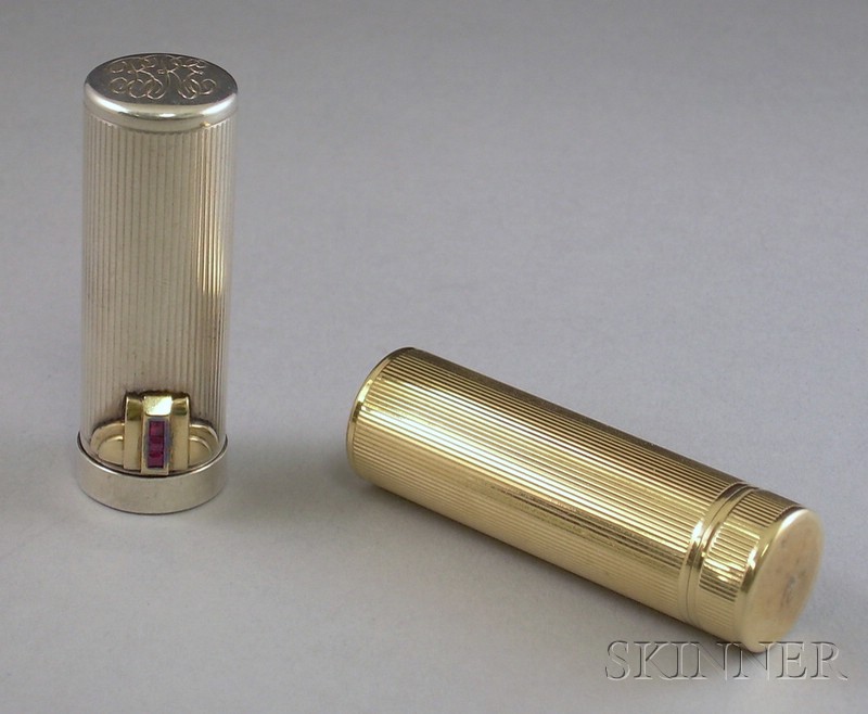 Appraisal: Two kt Gold and Silver Lipstick Cases one kt gold