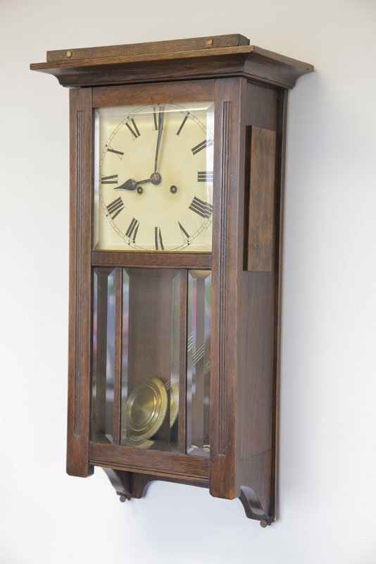 Appraisal: WALL CLOCK Eight day time strike clock with brass works