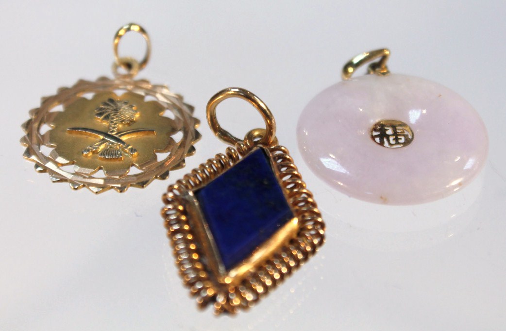 Appraisal: Three various pendants to include a white jade disc with