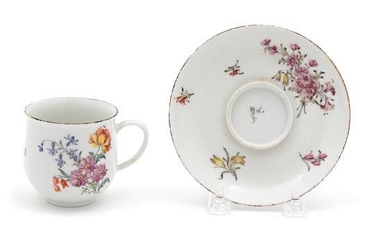 Appraisal: A Chelsea Porcelain Cup and Trembleuse Saucer Diameter of saucer