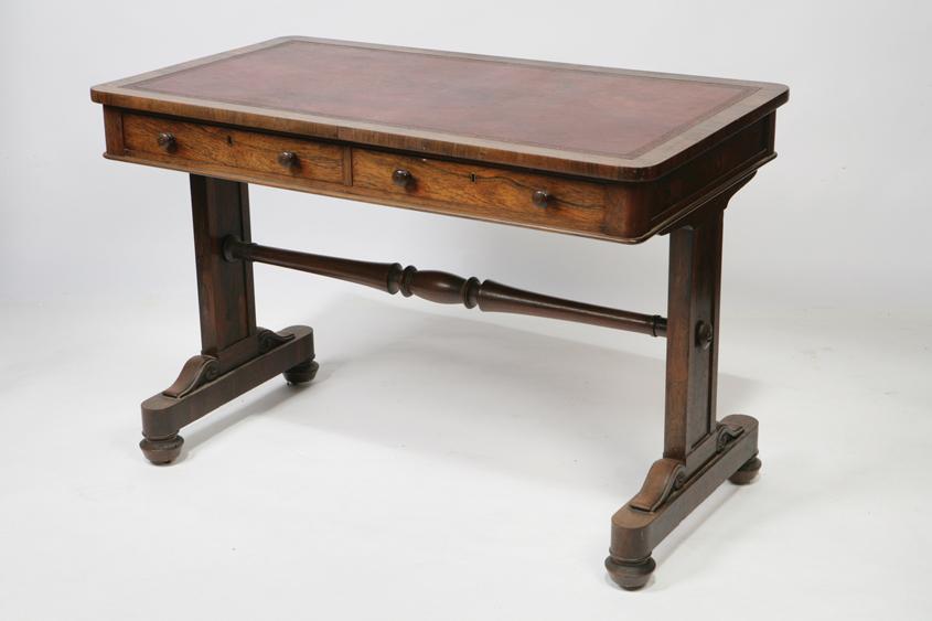 Appraisal: A REGENCY ROSEWOOD WRITING TABLE the rectangular top with rounded