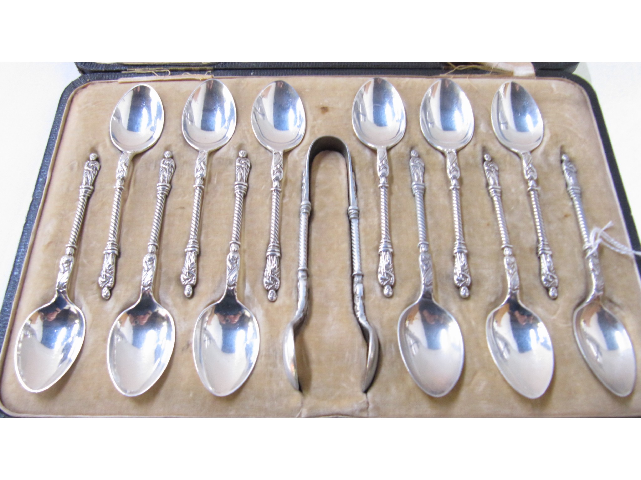 Appraisal: A cased set of twelve silver apostle spoons with tongs