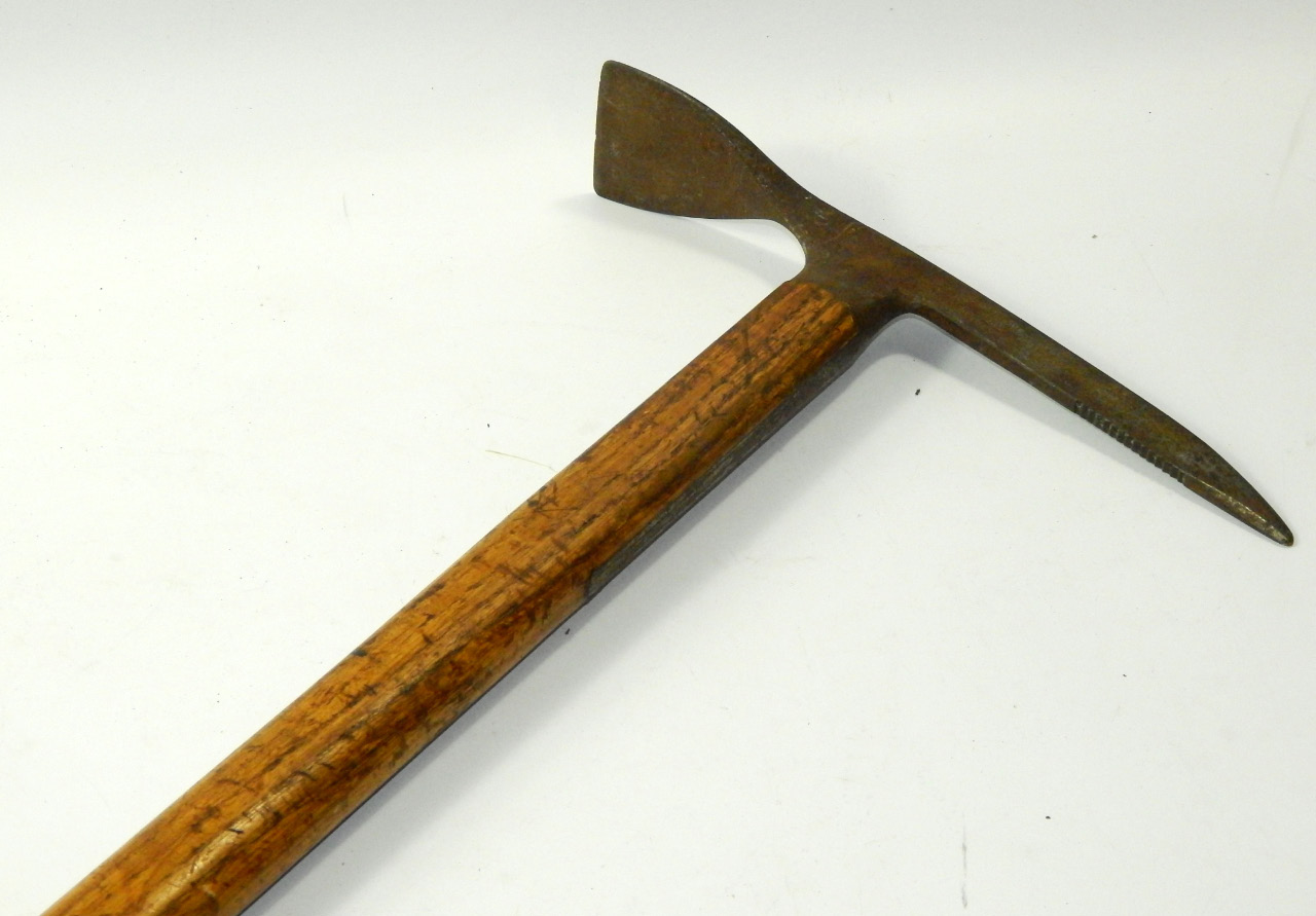 Appraisal: A German mountaineer's pick axe early thC wooden shafted impressed