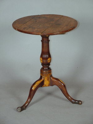 Appraisal: A George III yew wood tripod table with three plank