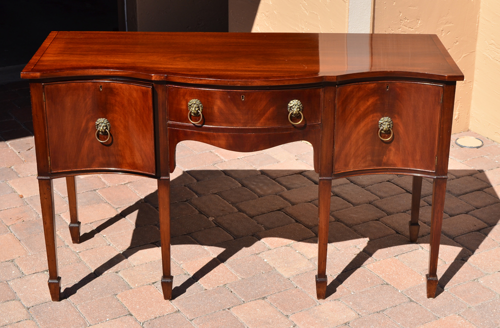 Appraisal: SHERATON STYLE TH CENTURY MAHOGANY SIDEBOARD Serpentine top and front