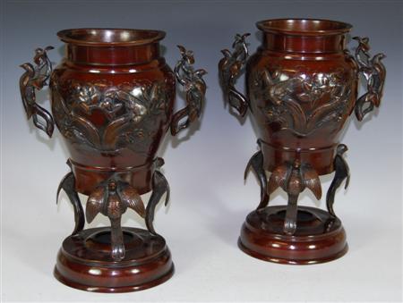 Appraisal: A pair of Japanese patinated bronze vases each twin handled