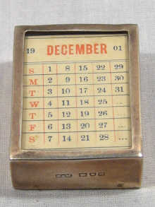 Appraisal: A small silver paperweight in the form of a calendar