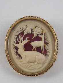 Appraisal: A brooch depicting a stag finely carved in ivory and