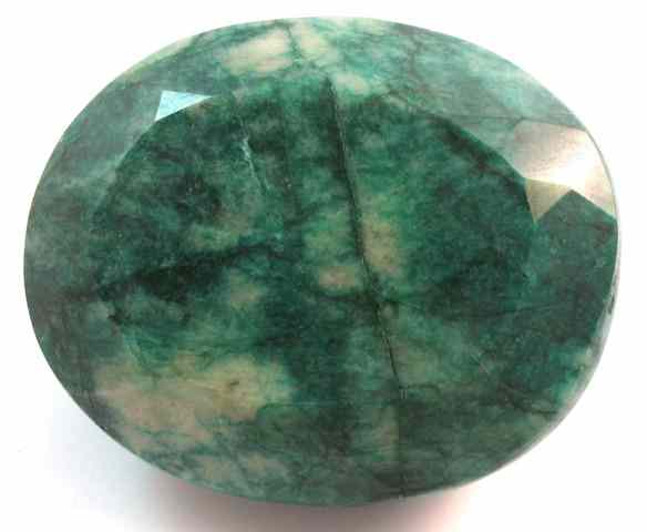 Appraisal: LARGE UNSET EMERALD WITH APPRAISAL The cts oval-cut opaque green