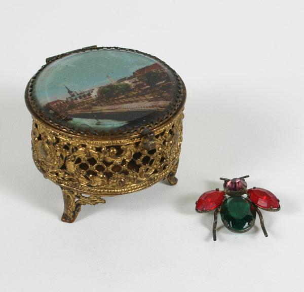 Appraisal: Pierced gilt metal jewelry box with a view of an