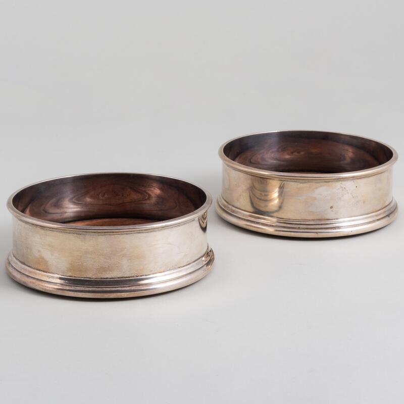 Appraisal: Pair of English Silver Bottle Coasters Mark of Solomon Joel