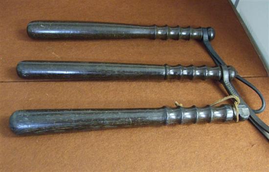 Appraisal: Three early th century policeman's truncheons with turned handles the