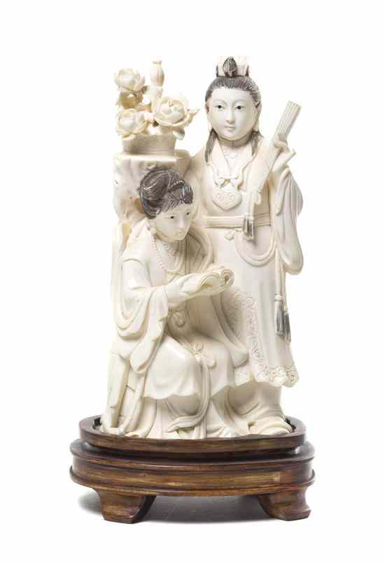 Appraisal: A Chinese Ivory Figural Group depicting two women one standing