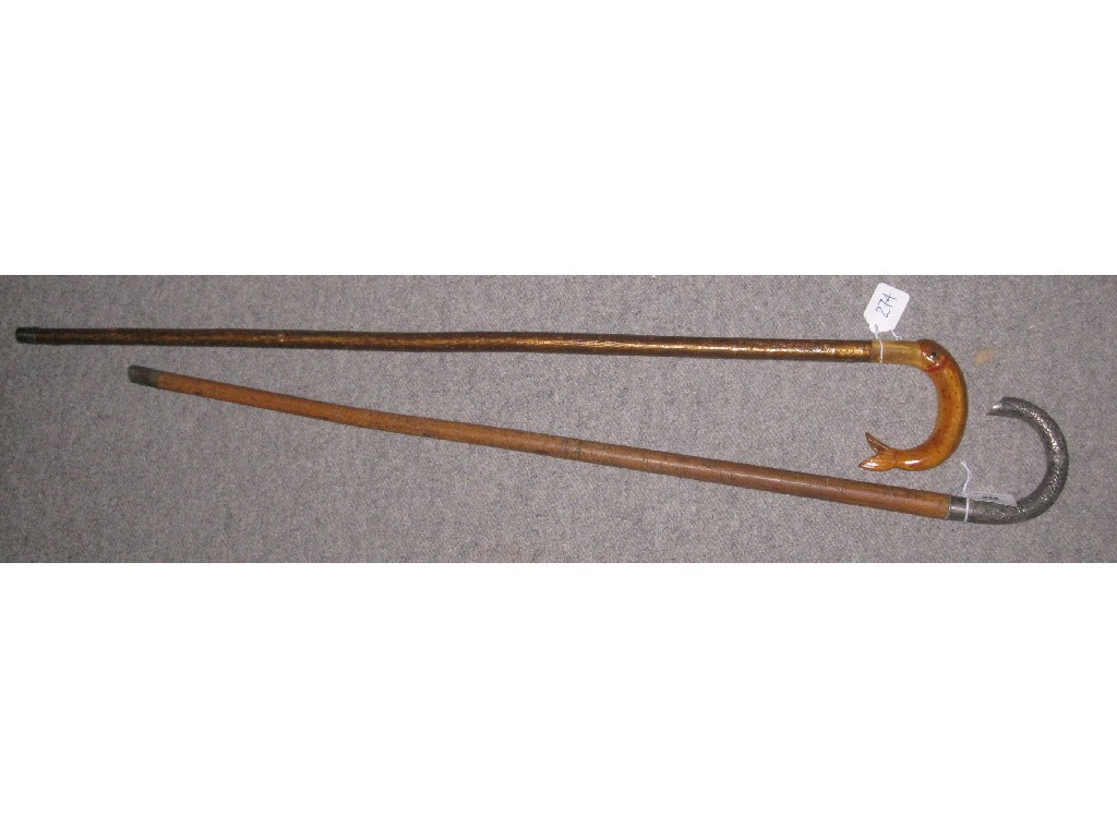 Appraisal: Lot comprising two walking sticks - one fish handle the