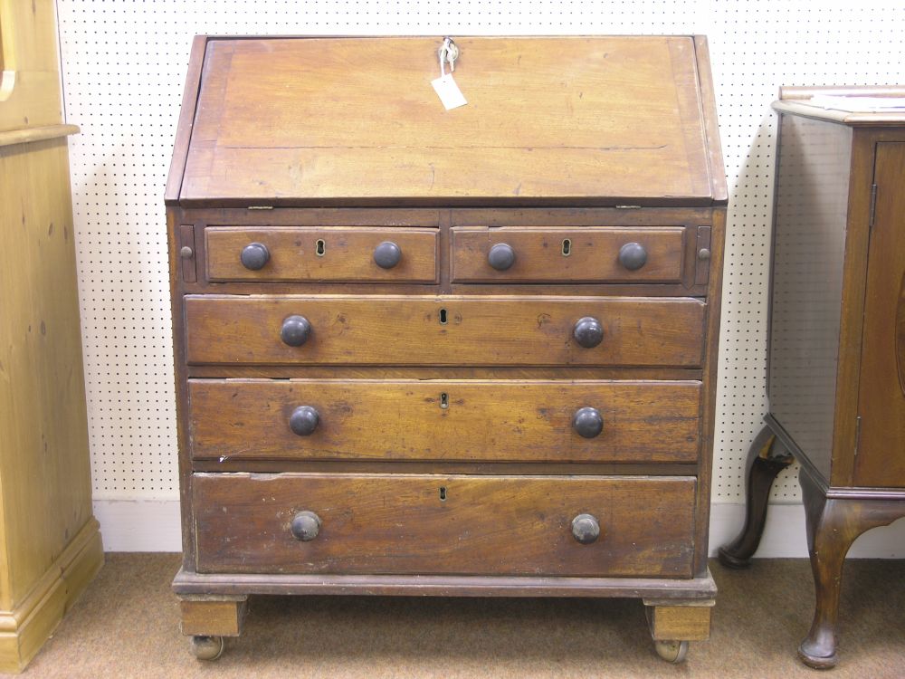 Appraisal: A George III mahogany bureau fall-front enclosing an arrangement of