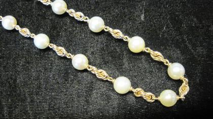 Appraisal: karat yellow gold and pearl necklaceFrench rope twist chain accented