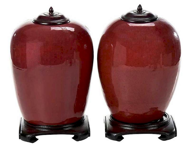 Appraisal: Near Pair Chinese Sang de Boeuf Jars on Stands Republic