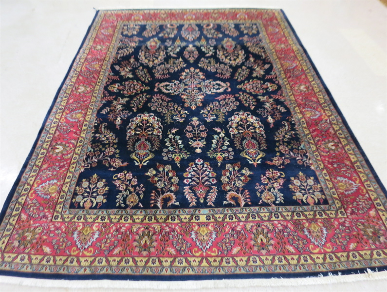 Appraisal: HAND KNOTTED ORIENTAL CARPET Indo-Sarouk floral sprig pattern on dark