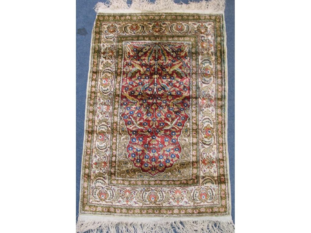 Appraisal: A TURKISH KAYSERI SILK PRAYER RUG the central red medallion