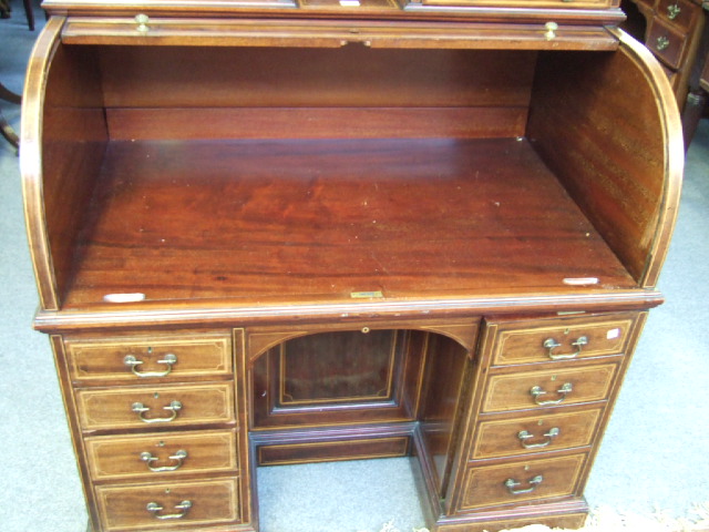 Appraisal: A late th century mahogany free standing roll top desk