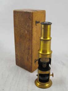 Appraisal: A small brass travelling microscope with three object lenses in