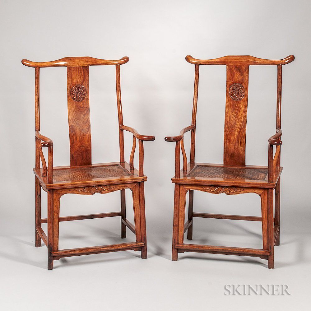 Appraisal: Pair of Huanghuali Yoke-back Armchairs Pair of Huanghuali Yoke-back Armchairs