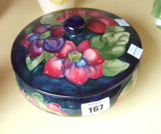 Appraisal: A Moorcroft powder bowl and cover in the Clematis pattern