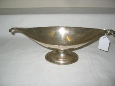 Appraisal: AN EDWARDIAN FRUIT DISH of boat form with moulded rim