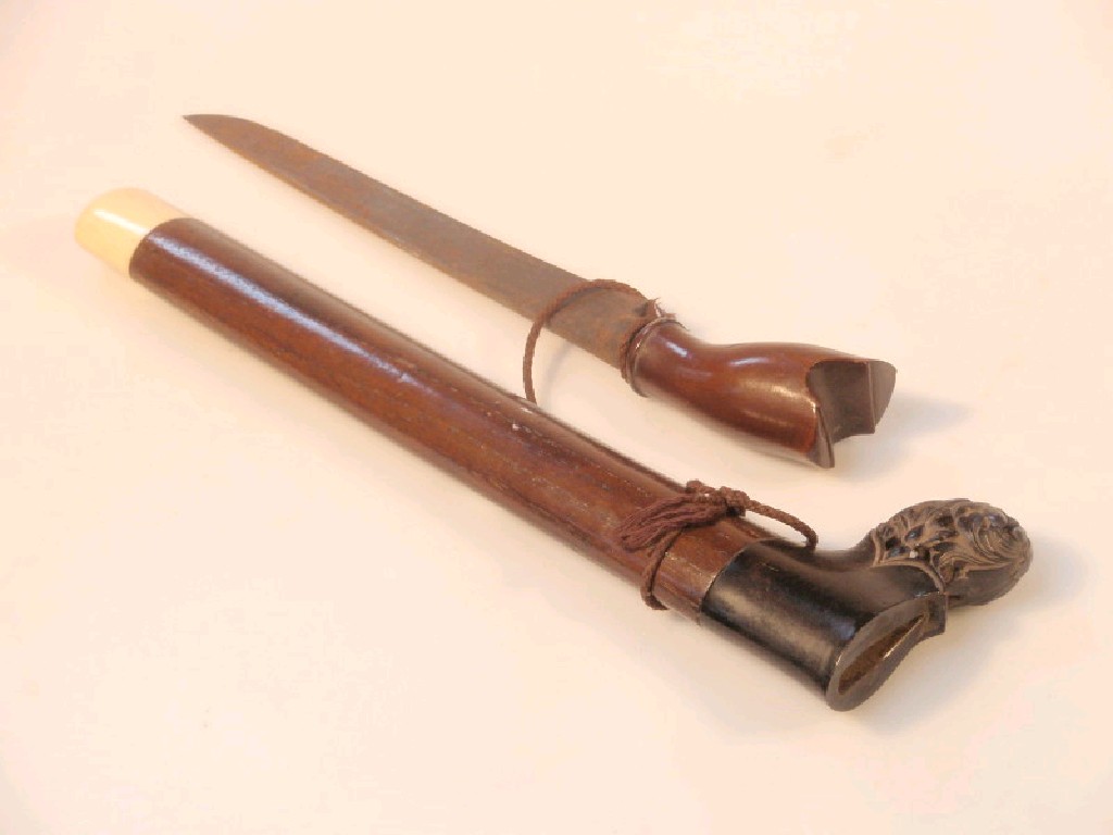 Appraisal: A Kris and a carved hardwood sheath with ivory finial