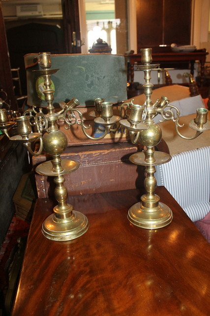 Appraisal: A PAIR OF DUTCH BRASS CANDELABRA each on turned bases