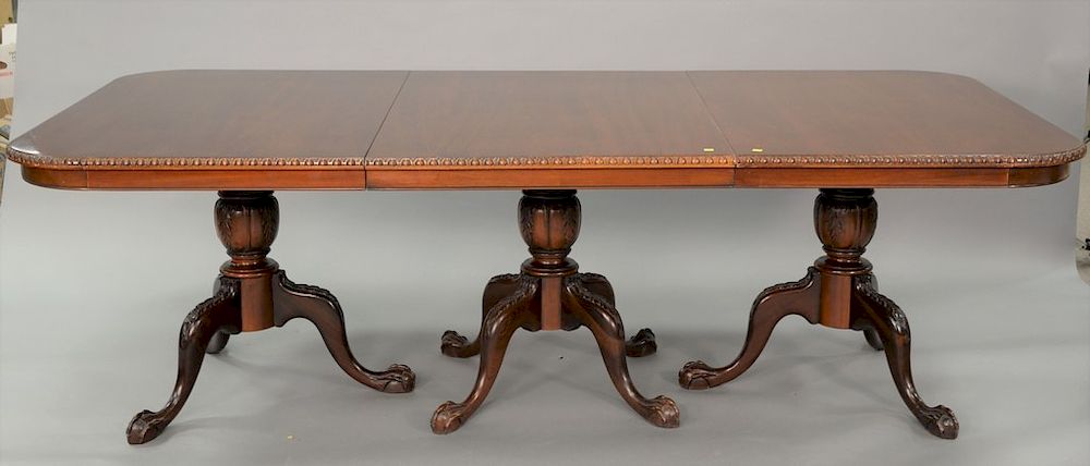 Appraisal: Mahogany triple pedestal dining table with ball and claw feet