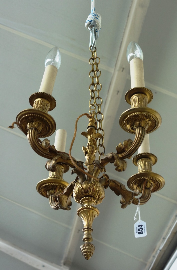 Appraisal: A pair of French ormolu four branch chandeliers th century